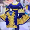 A traditional Afghani Gand dress featuring intricate embroidery, wide sleeves, and a flowing silhouette, representing Afghan cultural heritage."