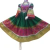 Half Afghani Gand dress with intricate embroidery, mirror work, and a flowing skirt, blending traditional Afghan patterns with a modern silhouette."