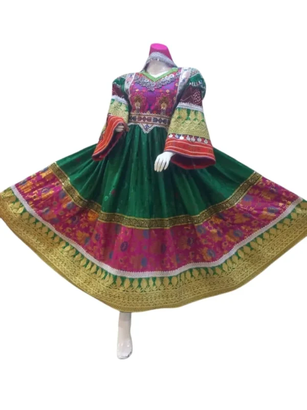 Half Afghani Gand dress with intricate embroidery, mirror work, and a flowing skirt, blending traditional Afghan patterns with a modern silhouette."