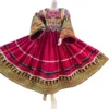 Traditional Afghani Gand dress with intricate embroidery, mirror work, and vibrant colors, representing Afghan cultural heritage."