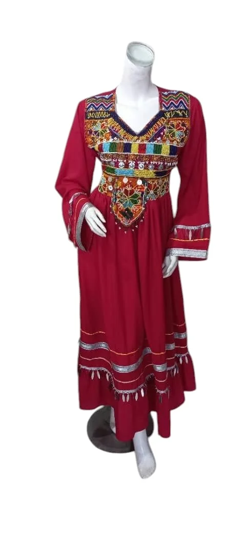 A traditional Afghani Gand dress with intricate embroidery, long flowing sleeves, and vibrant colors, displayed on a mannequin."