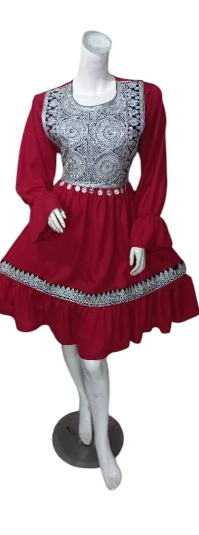 traditional Afghani Gand dress with intricate embroidery, long flowing sleeves, and vibrant colors, displayed on a mannequin."