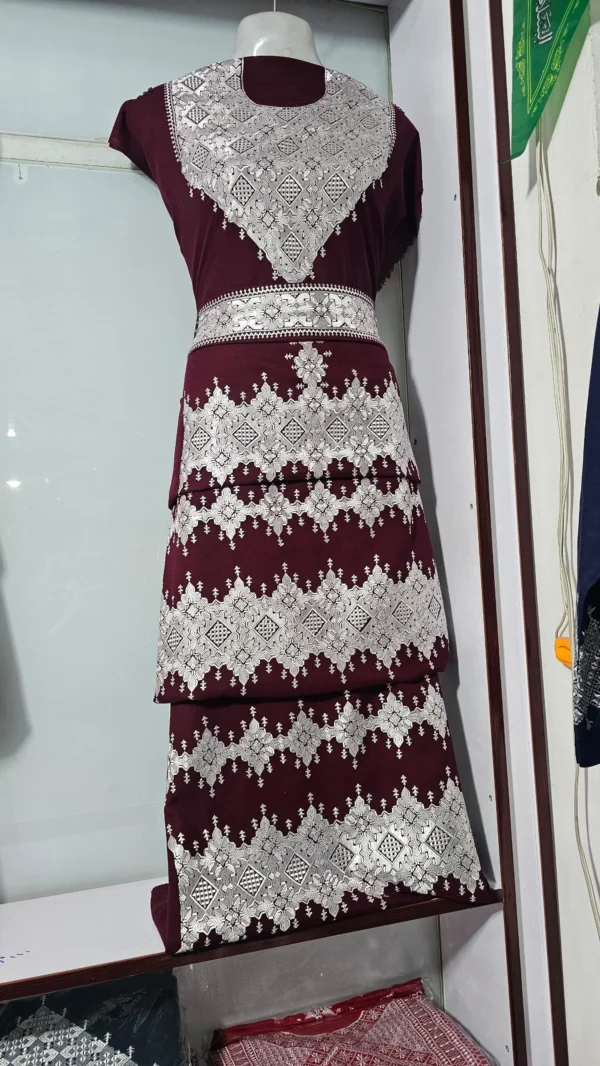 traditional Hazaragi handmade dress featuring intricate embroidery, vibrant colors, and unique handcrafted details, reflecting rich Hazara culture."