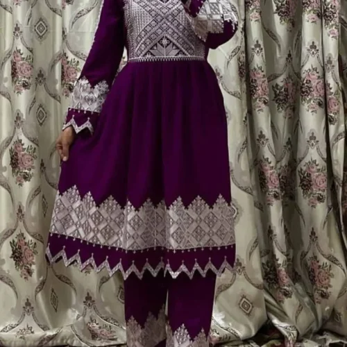 traditional Hazargi embroidered dress featuring intricate hand-stitched patterns, vibrant colors, and cultural motifs, crafted from luxurious fabric."