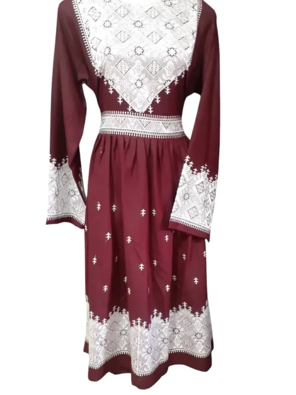 traditional Hazaragi dress with intricate embroidery, vibrant colors, and cultural patterns, reflecting the rich heritage of the Hazara people."