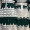 A beautifully handcrafted Hazaragi dress with intricate embroidery, beadwork, and vibrant colors, showcasing the rich cultural heritage of the Hazara people."