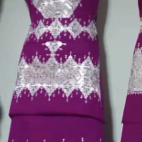 A beautifully handcrafted Hazaragi dress with intricate embroidery, beadwork, and vibrant colors, showcasing the rich cultural heritage of the Hazara people."