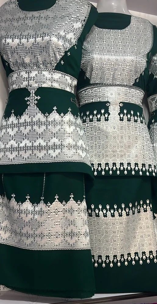 A beautifully handcrafted Hazaragi dress with intricate embroidery, beadwork, and vibrant colors, showcasing the rich cultural heritage of the Hazara people."