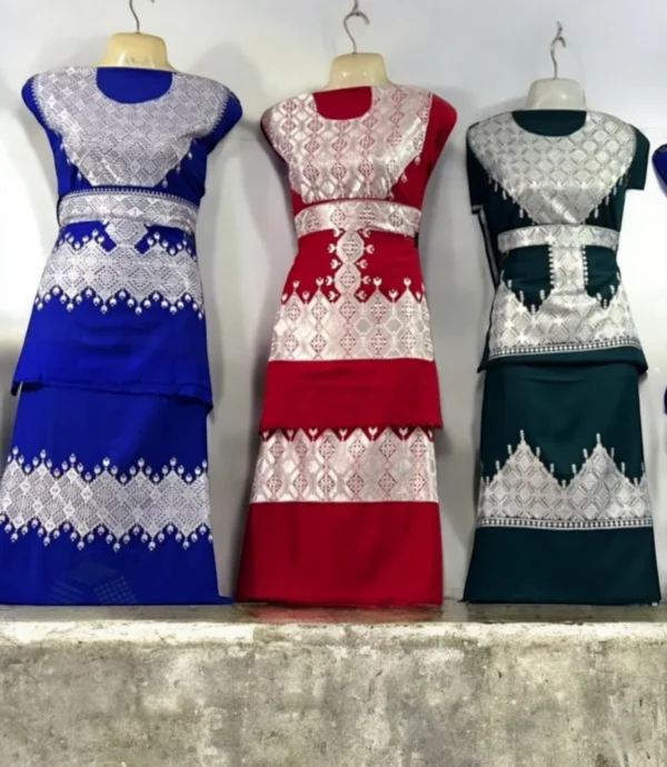 A beautifully handcrafted Hazaragi dress with intricate embroidery, beadwork, and vibrant colors, showcasing the rich cultural heritage of the Hazara people."