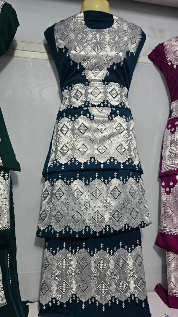 traditional Hazaragi handmade dress featuring intricate embroidery, vibrant colors, and unique handcrafted details, reflecting rich Hazara culture."