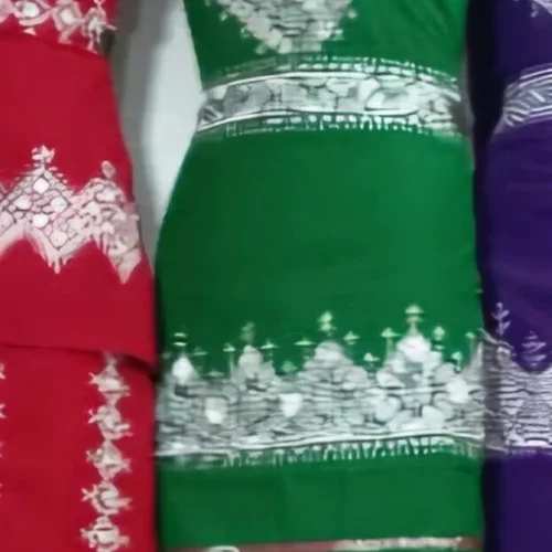 A beautifully handcrafted Hazaragi dress adorned with intricate embroidery, beadwork, and vibrant patterns. Made from luxurious fabric, the dress reflects the rich cultural heritage and artisanal skills of the Hazara people.