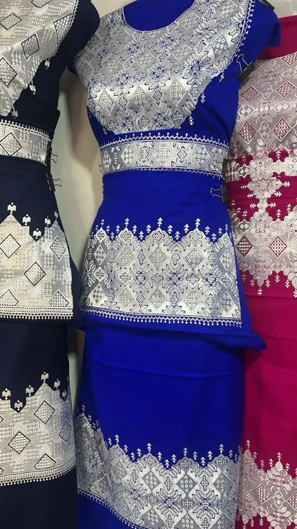 A beautifully handcrafted Hazaragi dress with intricate embroidery, beadwork, and vibrant colors, showcasing the rich cultural heritage of the Hazara people."