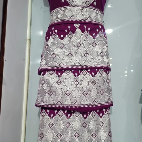 A traditional Hazaragi handmade dress featuring intricate embroidery, vibrant colors, and unique handcrafted details, reflecting rich Hazara culture."