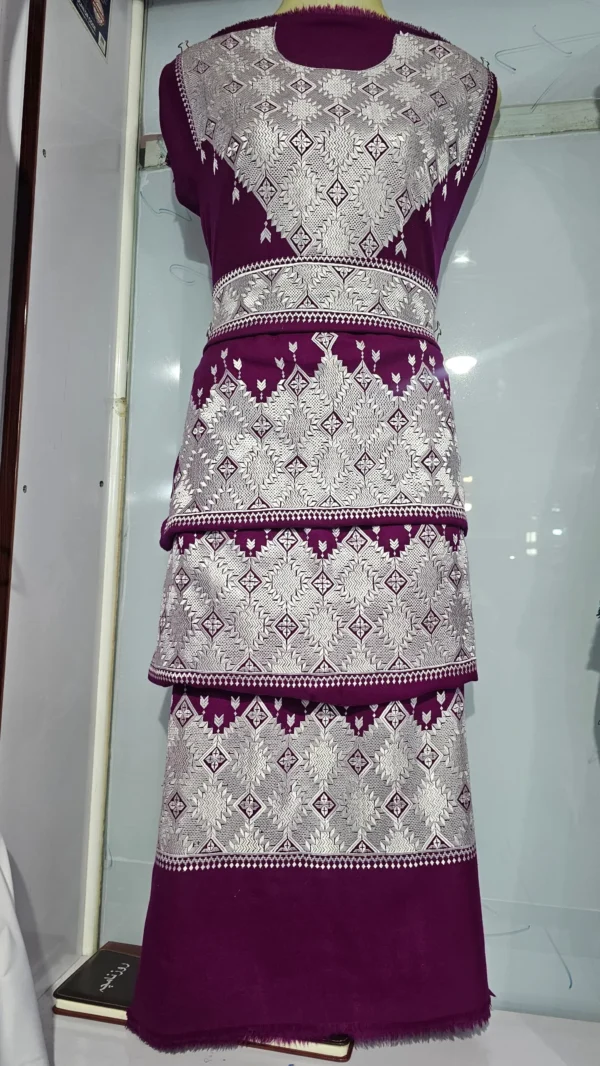 A traditional Hazaragi handmade dress featuring intricate embroidery, vibrant colors, and unique handcrafted details, reflecting rich Hazara culture."