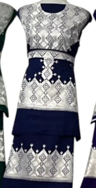 A beautifully handcrafted Hazaragi dress with intricate embroidery, beadwork, and vibrant colors, showcasing the rich cultural heritage of the Hazara people."