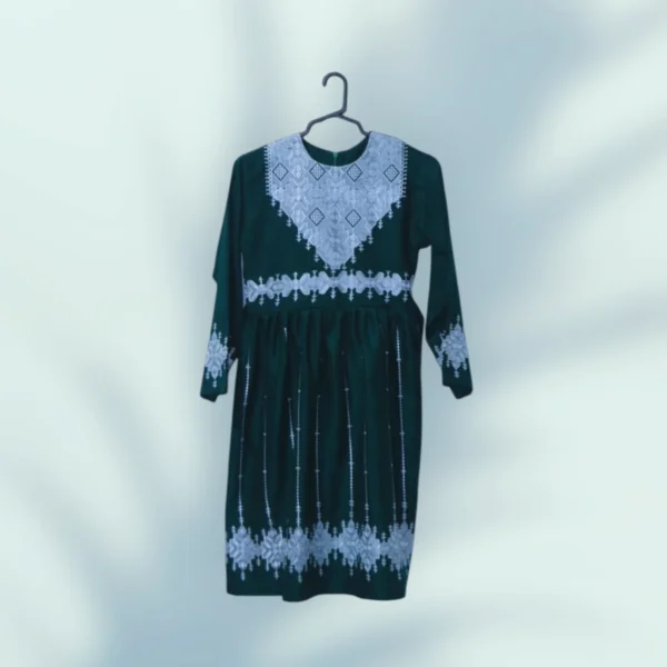 A stunning Hazaragi embroidered dress featuring intricate handmade embroidery, vibrant colors, and traditional beadwork, reflecting the rich cultural heritage of the Hazara people."