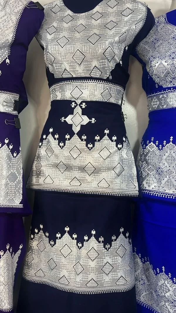 "A beautifully handcrafted Hazaragi dress with intricate embroidery, beadwork, and vibrant colors, showcasing the rich cultural heritage of the Hazara people."