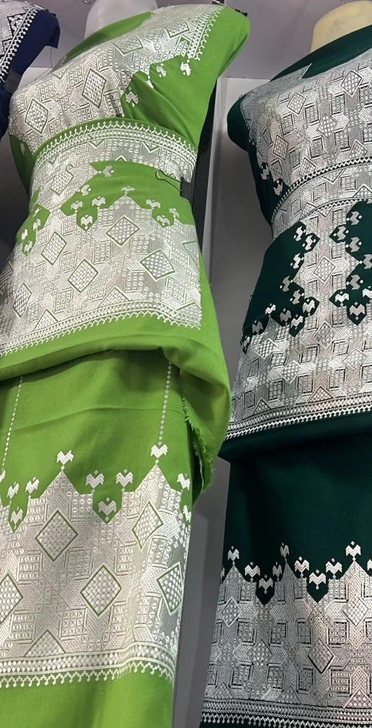 A beautifully handcrafted Hazaragi dress with intricate embroidery, beadwork, and vibrant colors, showcasing the rich cultural heritage of the Hazara people."