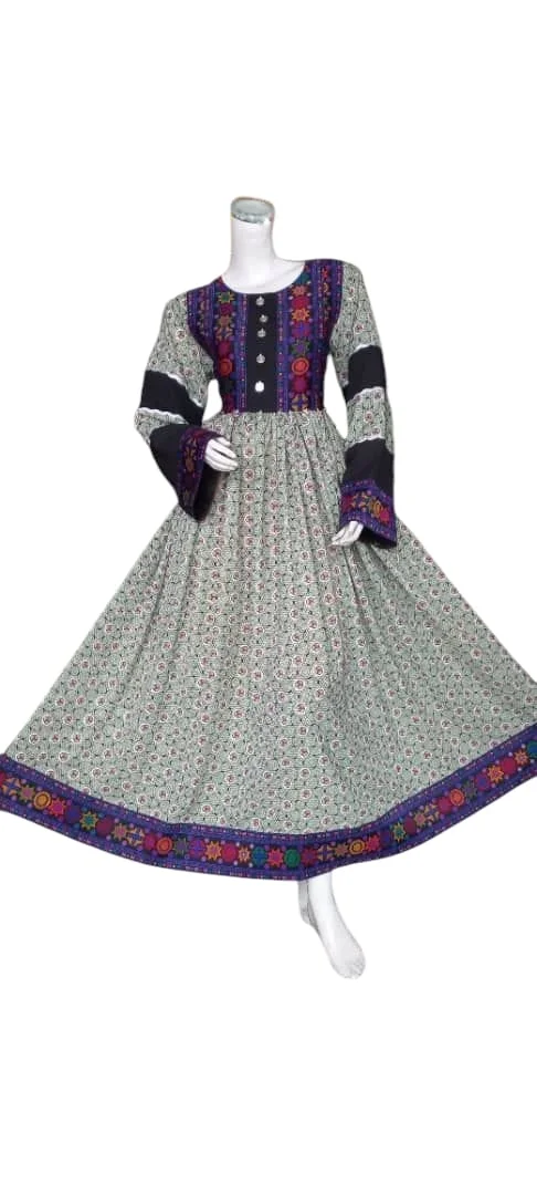 A traditional Afghani Gand dress with intricate embroidery, long flowing sleeves, and vibrant colors, displayed on a mannequin."