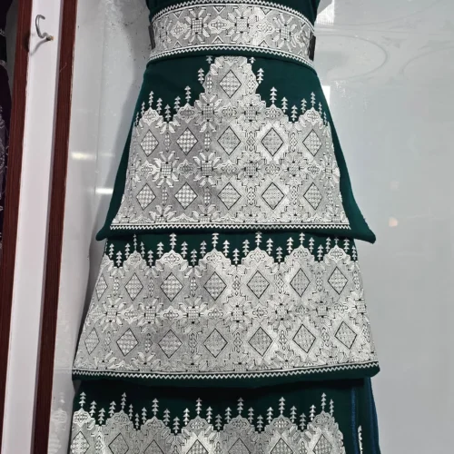 A traditional Hazaragi handmade dress featuring intricate embroidery, vibrant colors, and unique handcrafted details, reflecting rich Hazara culture."