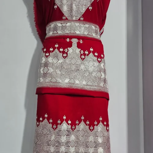 traditional Hazaragi dress with intricate embroidery, vibrant colors, and cultural patterns, reflecting the rich heritage of the Hazara people."