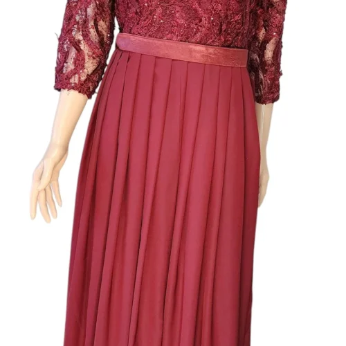 maroon party wear dress with elegant embroidery, a flowing silhouette, and a luxurious fabric, perfect for formal occasions."